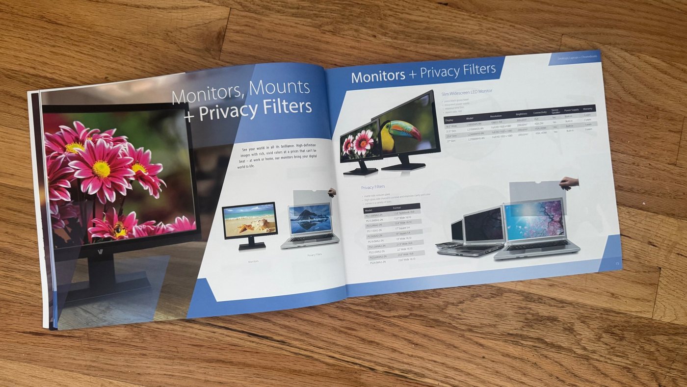 Inside spread of the V7 catalog showing monitors, mounts and privacy filters on a blue and white layout